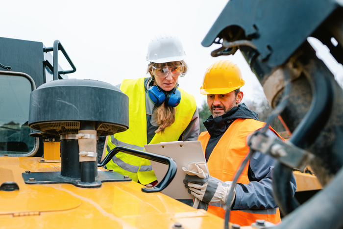 Man and Woman Working in a Quarry Wears Safety Gear